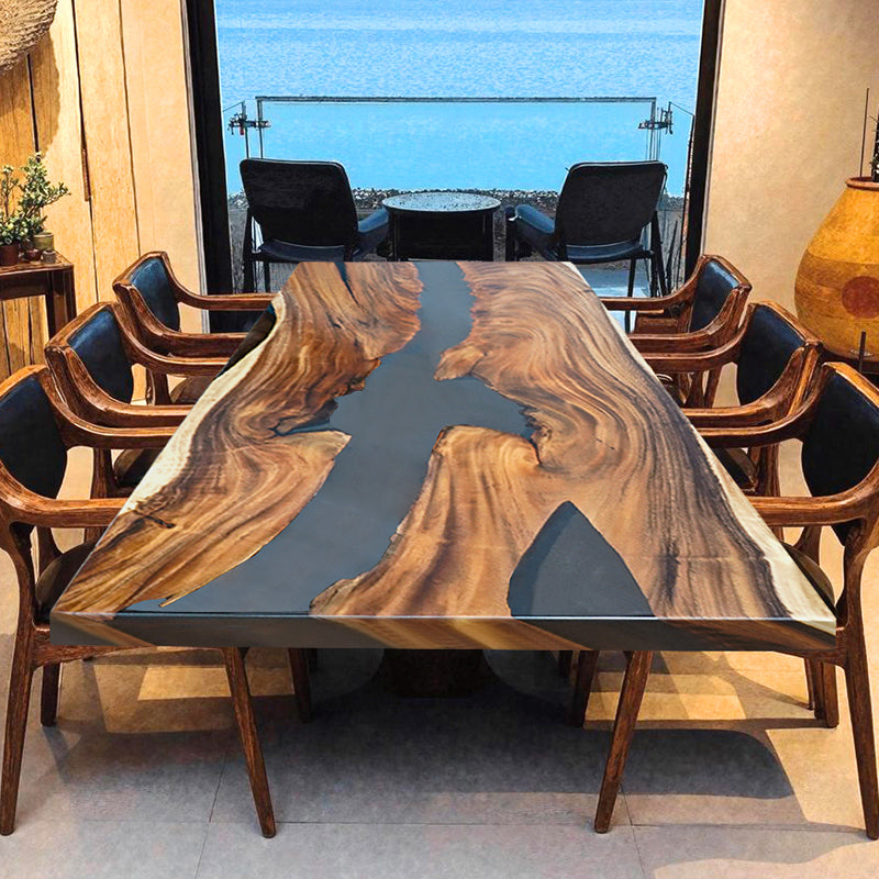 Handmade live edge epoxy resin dining table with natural wood slab and acrylic legs, perfect for modern interiors.