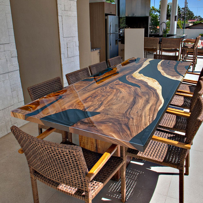 A handcrafted black epoxy resin river table with live edge wood, made from high-quality raw materials, perfect for dining or office use.