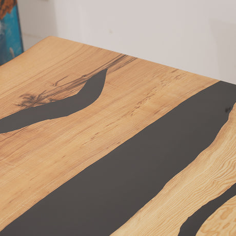 Handmade live edge epoxy resin dining table with natural wood slab and acrylic legs, perfect for modern interiors.