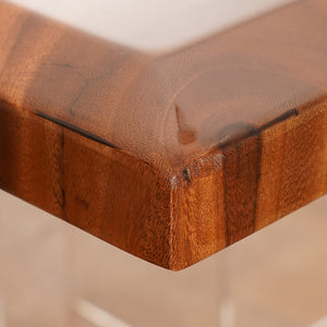 A handcrafted black epoxy resin river table with live edge wood, made from high-quality raw materials, perfect for dining or office use.