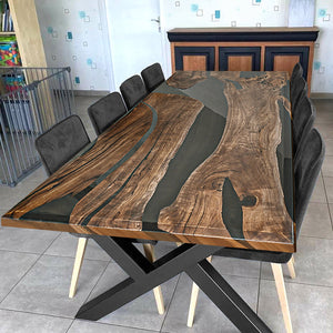 A luxury handcrafted epoxy river dining table made from solid wood and high-gloss resin, featuring a modern design with acrylic legs.
