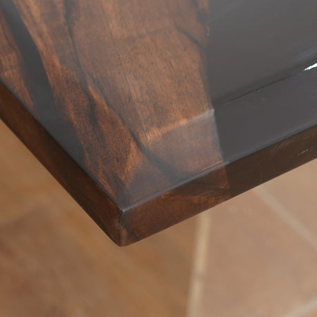 A luxury handcrafted epoxy river dining table made from solid wood and high-gloss resin, featuring a modern design with acrylic legs.