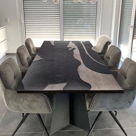 Luxury black epoxy resin river table with live edge wood and acrylic legs, perfect for dining or office spaces.