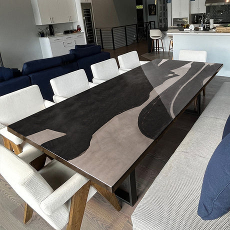 Luxury black epoxy resin river table with live edge wood and acrylic legs, perfect for dining or office spaces.