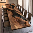 Handcrafted black walnut conference table featuring a flowing black epoxy resin river, dramatic natural wood grain, and a smooth polished finish