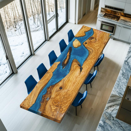 A custom live-edge walnut table crafted from natural wood, featuring a striking blue epoxy-resin inlay, accompanied by a uniquely designed wooden chair with resin details