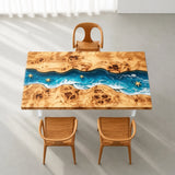 High-gloss poplar coffee tabletop featuring translucent blue epoxy resin, layered ocean wave effects, decorative starfish, and natural wood knots