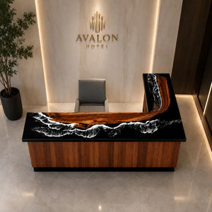 High-gloss walnut reception countertop featuring reflective black epoxy resin, intricate white ocean wave details, and flowing natural wood grain