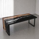 High-gloss walnut epoxy desktop featuring a reflective black resin surface, flowing white wave details, and distinctive natural wood grain