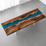 High-gloss black walnut conference tabletop featuring a reflective blue epoxy river, natural live edges, and warm brown wood tones