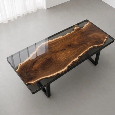 Live edge solid wood office desk framed with glossy black resin in a modern executive office
