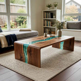 Natural wood coffee table featuring a flowing blue resin inlay across the tabletop