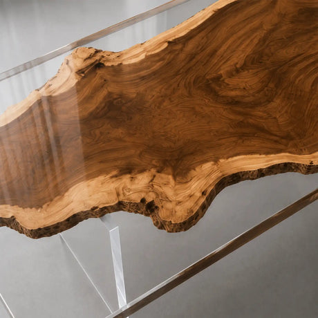 Luxury natural edge wood executive desk styled with a laptop and desk lamp