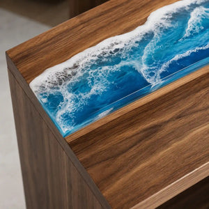 Luxury office reception desk with a striking blue epoxy ocean design, layered white seafoam effects, and contemporary walnut wood construction
