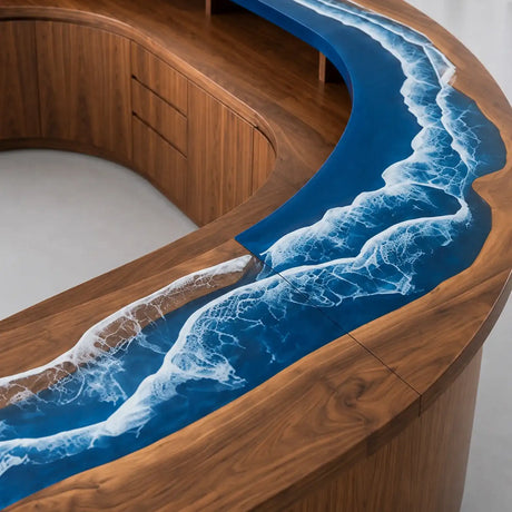 Modern curved walnut office reception desk featuring a raised ocean blue epoxy counter, integrated storage drawers, and a spacious interior workstation