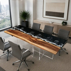 Modern walnut and black epoxy conference table supported by transparent acrylic pedestal legs and surrounded by black leather office chairs
