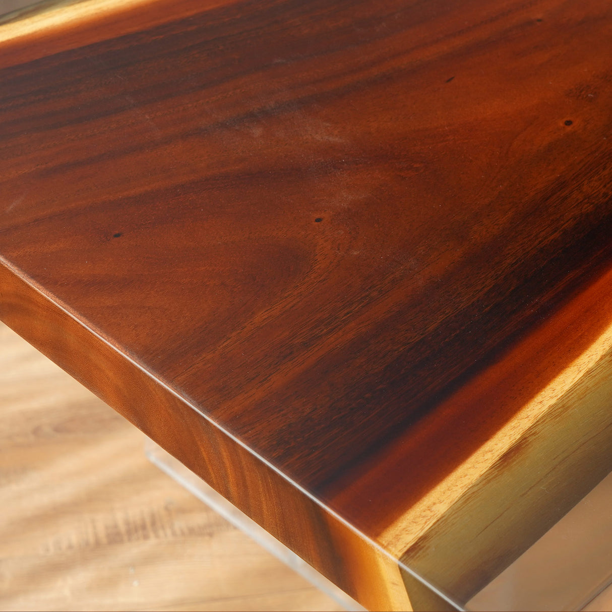 This rectangular dining table showcases a beautiful combination of rich, dark wood and a sleek, golden - toned epoxy - resin inlay that runs along its length. The natural wood grain is prominent, adding a rustic charm, while the glossy resin inlay provides a modern contrast, enhancing the table's visual appeal.