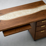 Wood and resin computer workstation with a keyboard shelf and desktop monitor